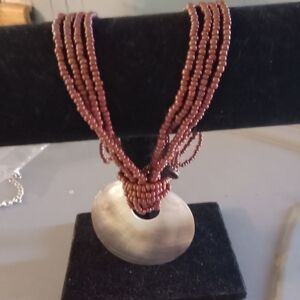 Elegant Brown Beaded Necklace with Shell Pendant